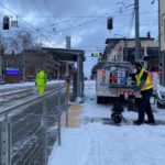Clearing a path at a Seattle Streetcar stop, First Hill Line.
