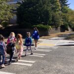 Students crossing the street near Lafayette Elementary School at an intersection where we installed all-way stop signs.