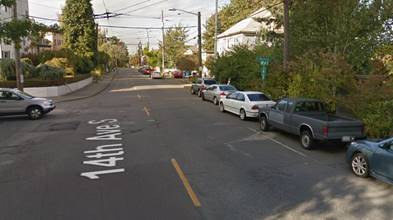 Before improvements at 14th Ave S and S Massachusetts St in Beacon Hill Cars are parked along the entire side of the street near a crossing. Photo Credit: Google.