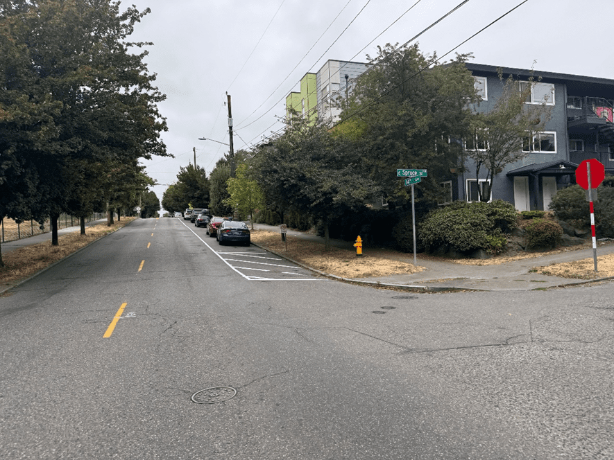 After improvements on 14th Ave and E Spruce St including no parking signs, a painted curb bulb and high visibility stop sign.
