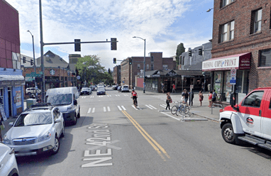 After improvements at NE 42nd St and University Way NE in the U District, which included adding an on-street bike corral. This provides micromobility parking and more visibility. Photo Credit: Google.