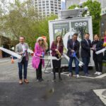 Ribbon cutting event in front of new restrooms in Pioneer Square.